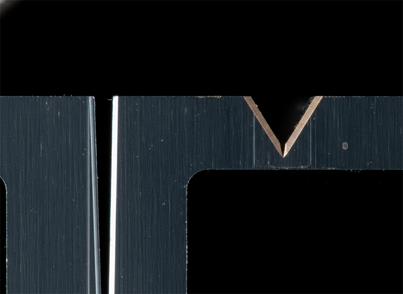Cross-section comparing a full laser dicing cut to a shallow laser scribe groove in a silicon wafer